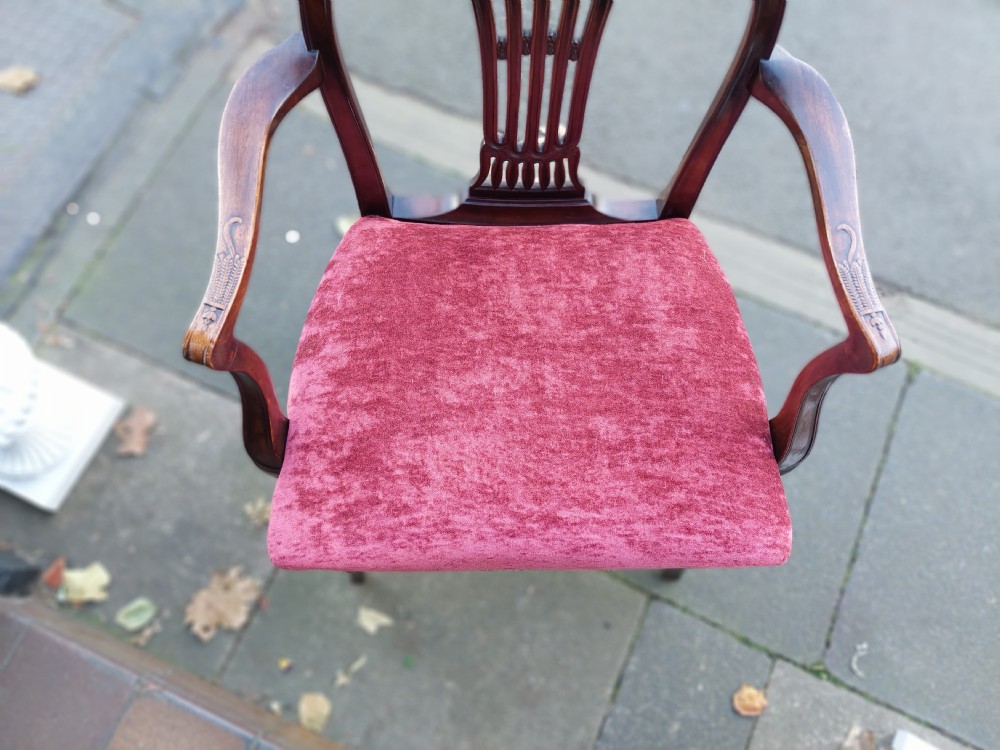 A late 19th-century Hepplewhite style mahogany armchair featuring a carved wheat sheaf oval backrest, curved arms, and a red velvet upholstered seat. View XII