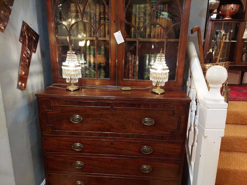 A pair of early 20th-century French style gilt brass table lustres featuring tiered strands of crystal beads and cascading prism drops. View X