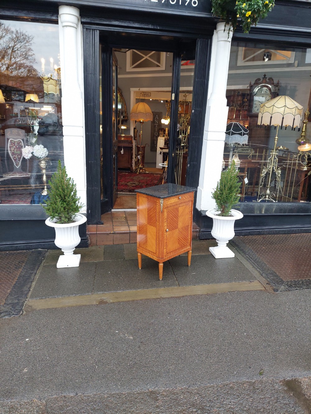 Late 19th-century French pot cupboard with kingwood and satinwood parquetry, dark marble top, single drawer, and tapered turned legs. View II