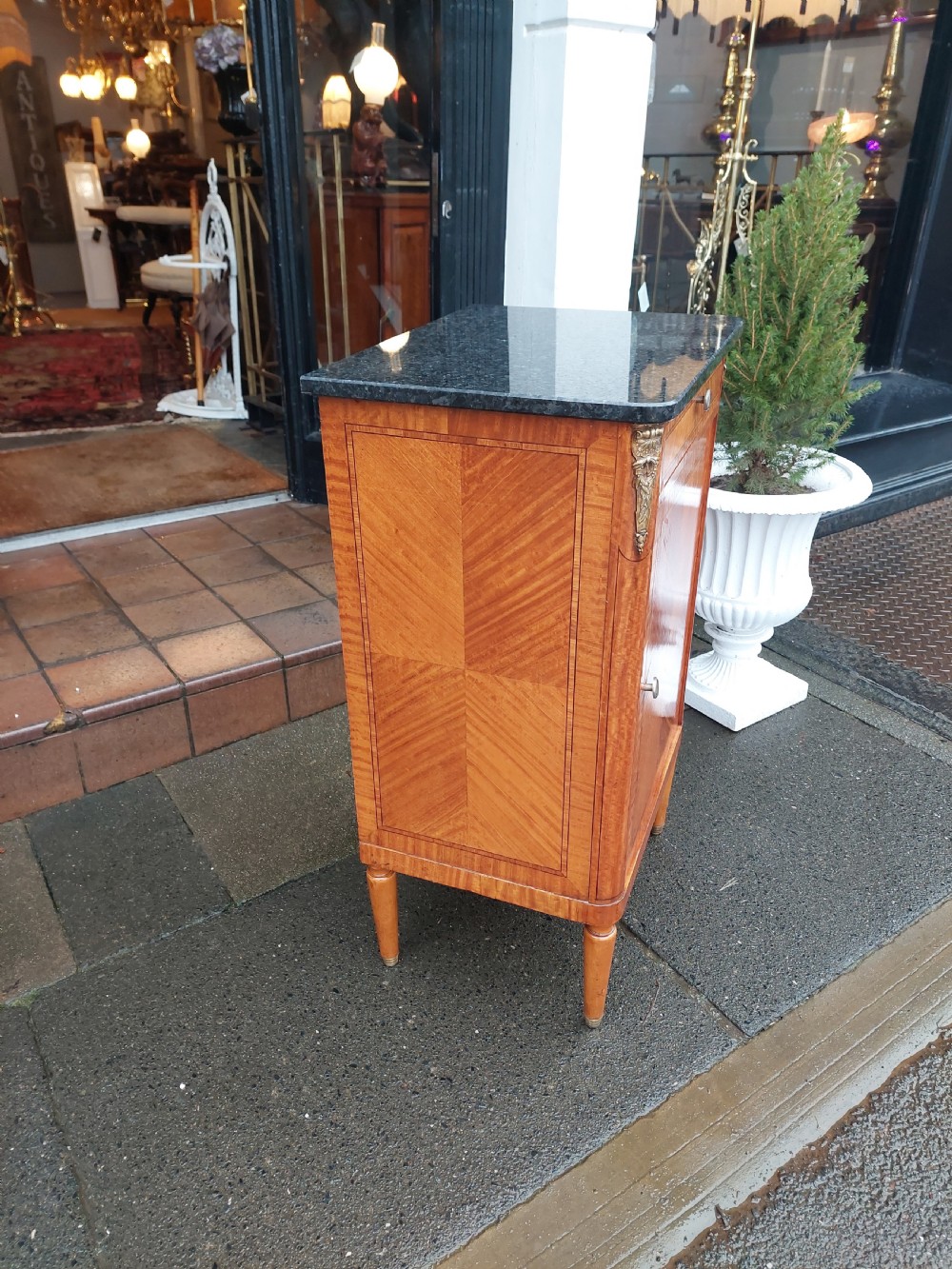 Late 19th-century French pot cupboard with kingwood and satinwood parquetry, dark marble top, single drawer, and tapered turned legs. View III