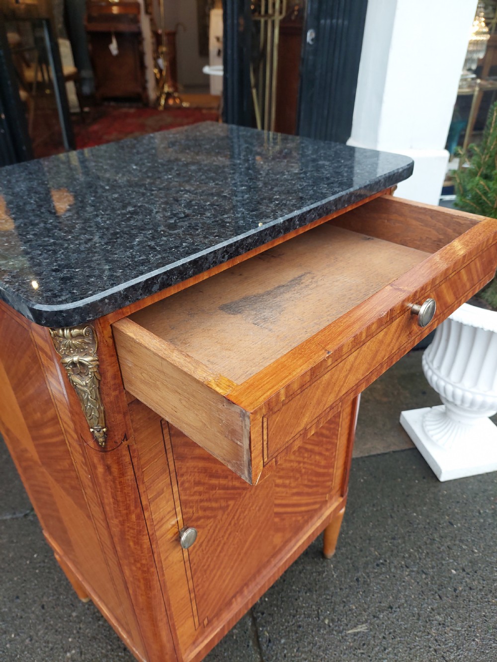 Late 19th-century French pot cupboard with kingwood and satinwood parquetry, dark marble top, single drawer, and tapered turned legs. View VI