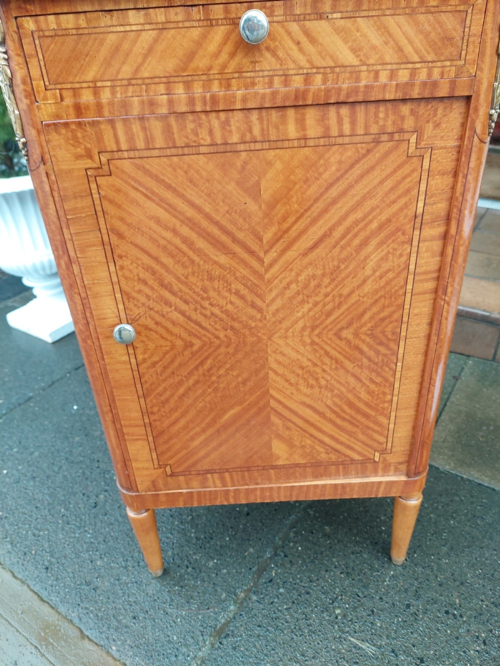 Late 19th-century French pot cupboard with kingwood and satinwood parquetry, dark marble top, single drawer, and tapered turned legs. View VII