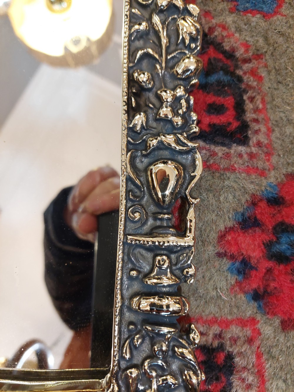 An ornate late Victorian rectangular wall mirror featuring a heavily detailed cast brass frame decorated with scrolls, floral motifs, and a crest detail at the top. View III