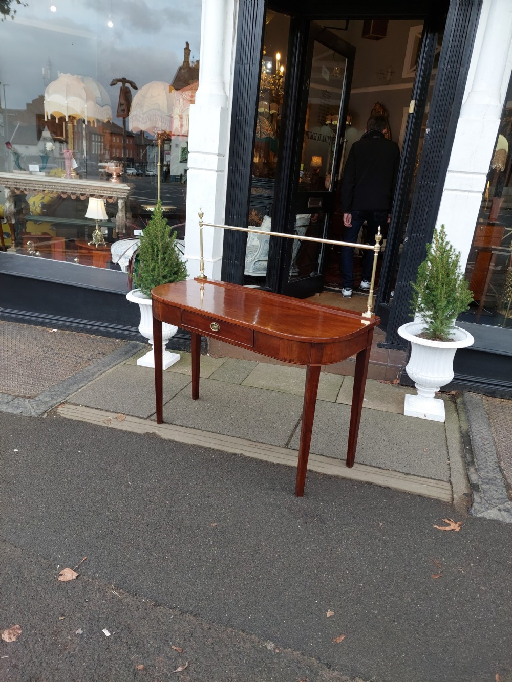 An Edwardian mahogany work table featuring satinwood line inlay and central shell marquetry motifs, elevated on slender splayed legs. View IV