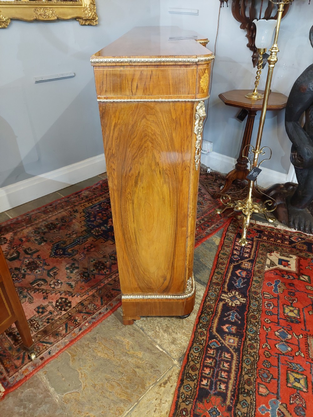 A nineteenth-century Victorian breakfront cabinet in burr walnut with marquetry inlay, gilt metal mounts, a central panelled door, and two side glazed display sections with velvet lining. View XIII