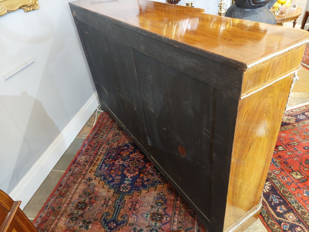 A nineteenth-century Victorian breakfront cabinet in burr walnut with marquetry inlay, gilt metal mounts, a central panelled door, and two side glazed display sections with velvet lining. View XIV