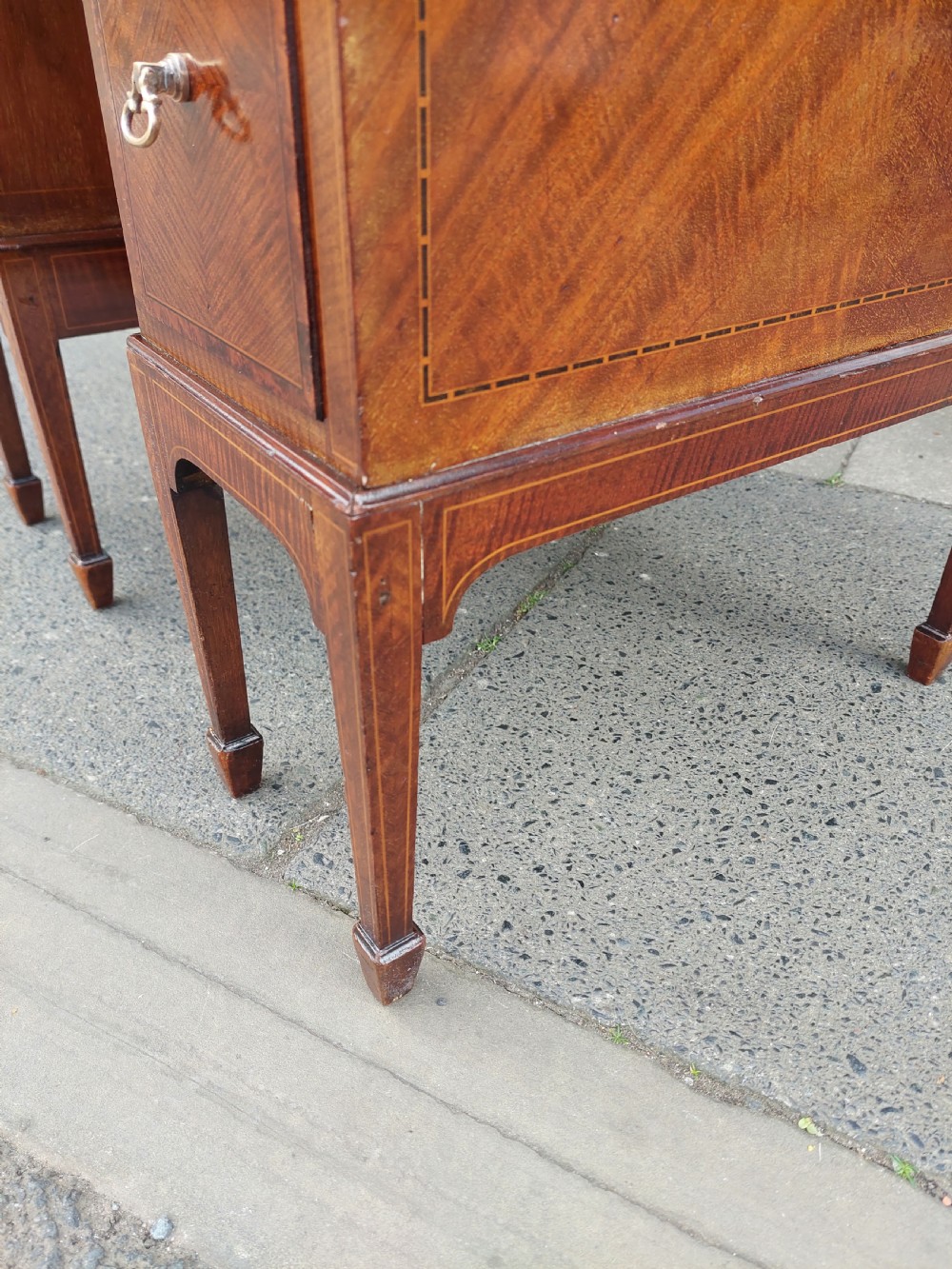 A late 19th-century George II style mahogany kneehole desk featuring herringbone inlay, brass drop handles, and a central recessed cupboard. View VIII