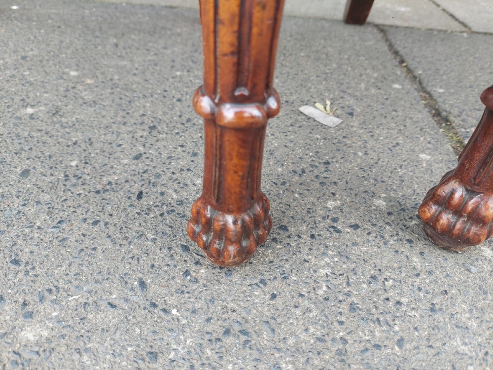 A pair of nineteenth-century carved walnut side chairs featuring openwork scrollwork backrests, turned legs, and cream floral pattern upholstery. View VIII