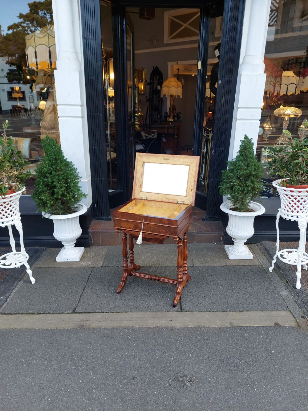 A late 19th-century mahogany sewing work table featuring a veneered rectangular top, turned support legs, a stretcher base, and a drop well. View II