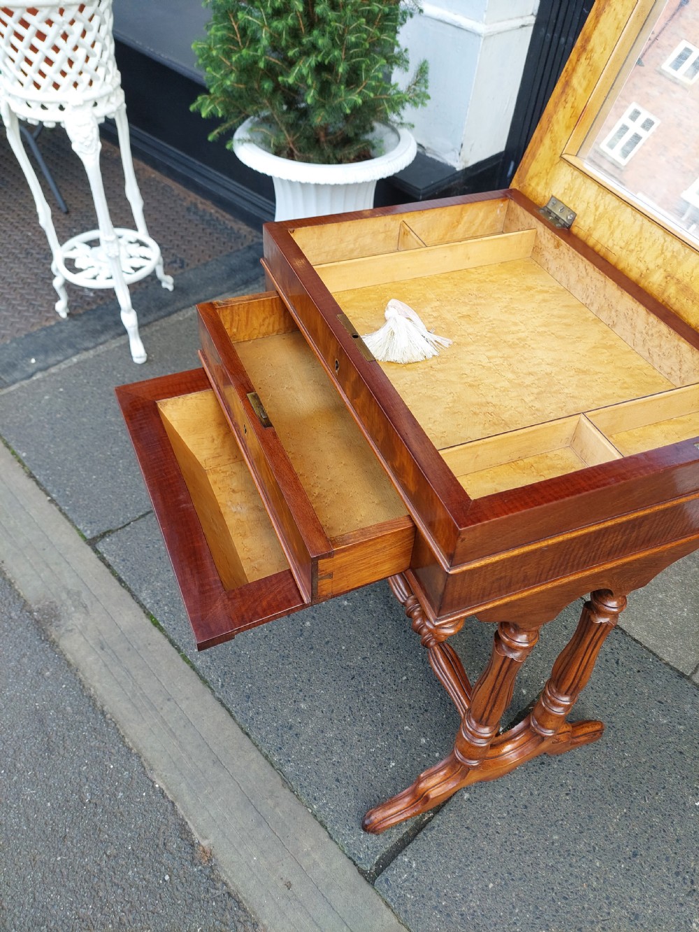 A late 19th-century mahogany sewing work table featuring a veneered rectangular top, turned support legs, a stretcher base, and a drop well. View VIII