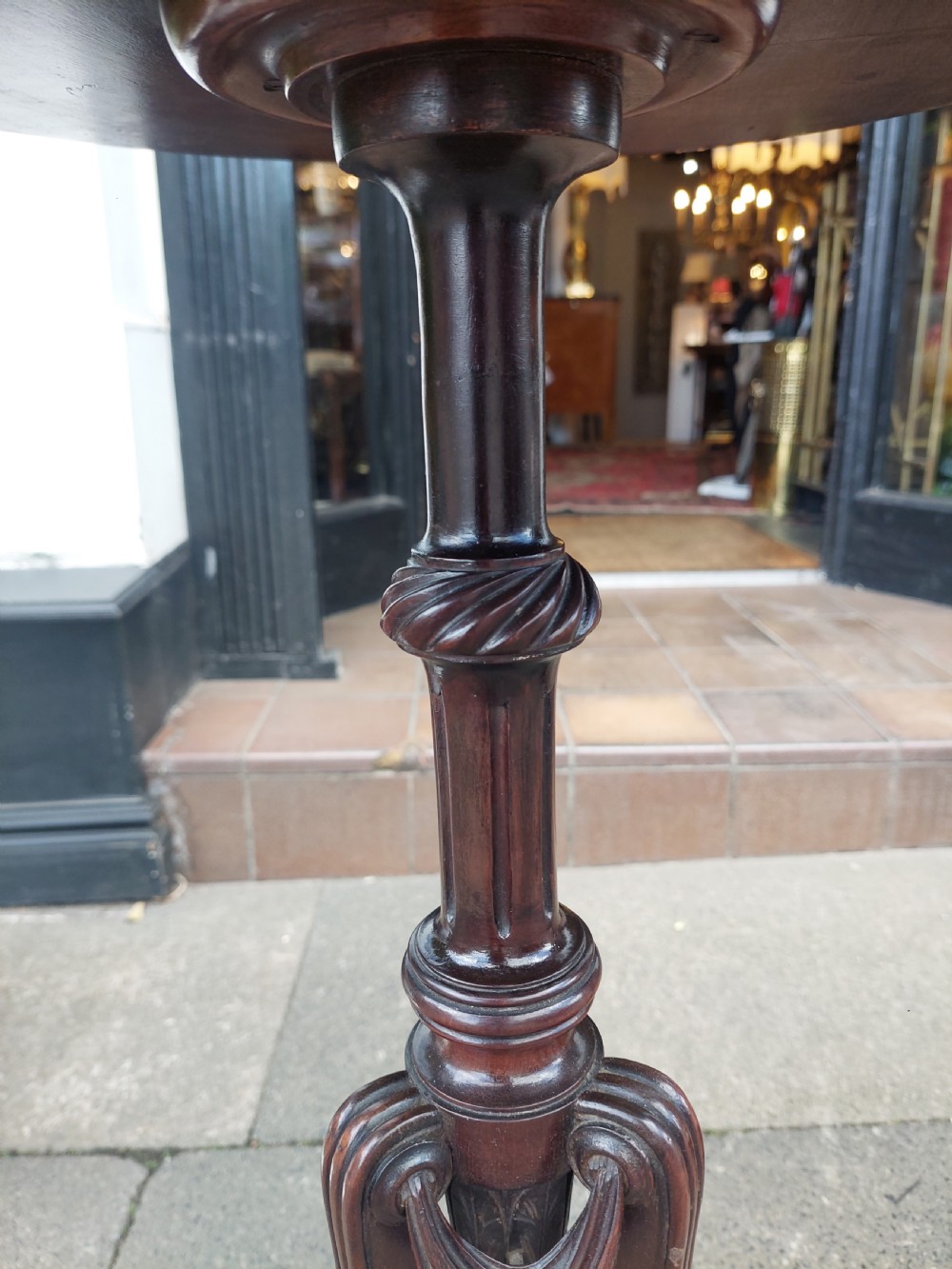 A pair of late Victorian mahogany occasional tables with circular tops, reeded columns, and carved tripod bases. View VIII