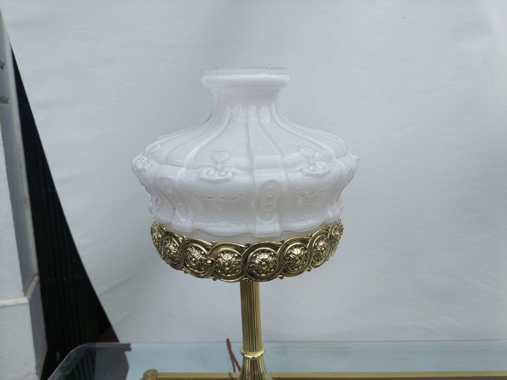 A late 19th-century Victorian brass table lamp featuring a fluted column, patterned brass rim gallery, and moulded white glass shade. View II