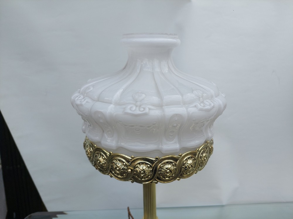 A late 19th-century Victorian brass table lamp featuring a fluted column, patterned brass rim gallery, and moulded white glass shade. View VI