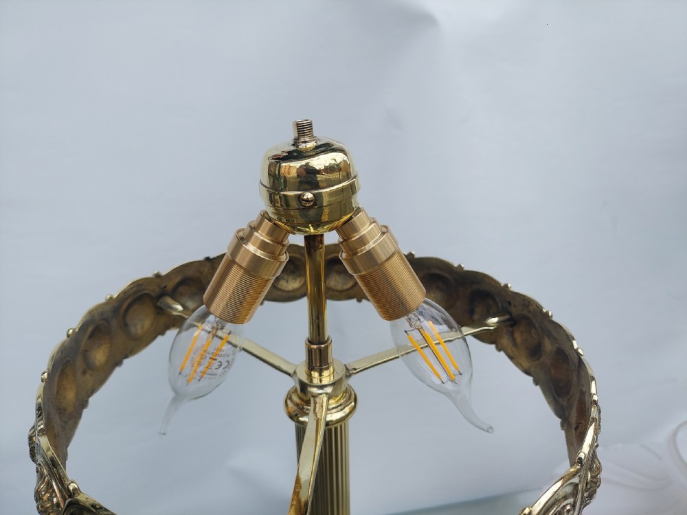 A late 19th-century Victorian brass table lamp featuring a fluted column, patterned brass rim gallery, and moulded white glass shade. View VIII