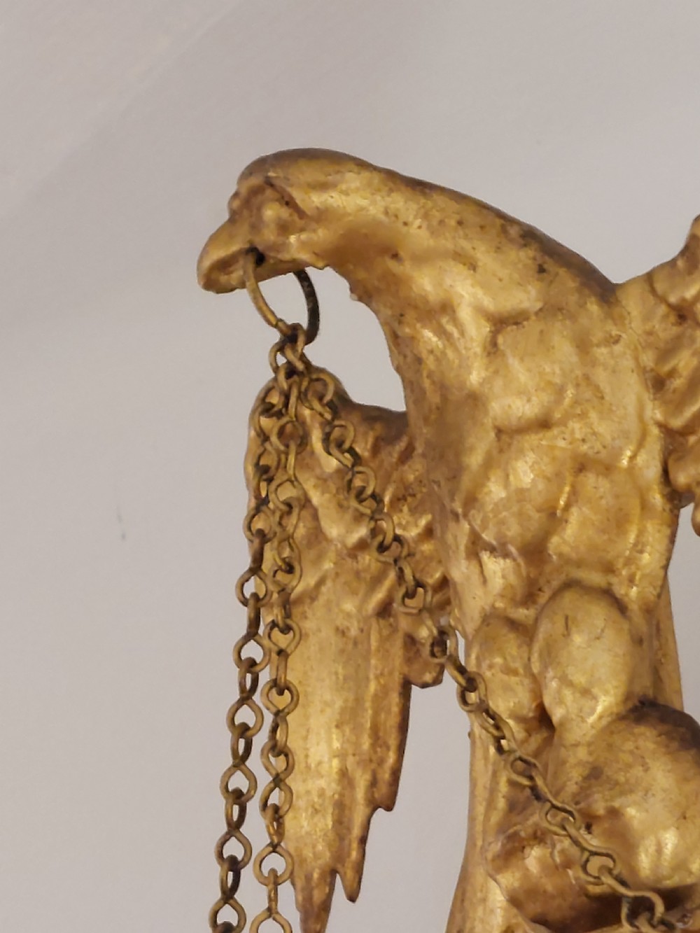 A tall rectangular George III giltwood pier mirror topped with a carved eagle cresting and decorative side urns. View VIII
