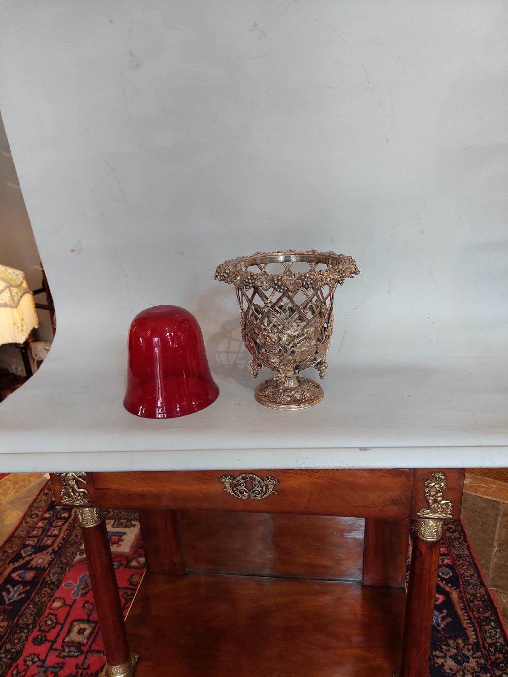 A late nineteenth-century cranberry glass wine cooler encased in an ornate silver-plated lattice frame with sculpted grapevine and leaf motifs. View VI