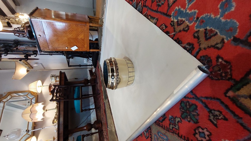 An early 20th-century French polished brass jardiniere featuring an embossed relief rim and a fluted lower base. View III