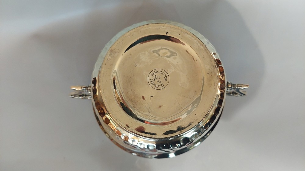 A late nineteenth-century French brass two-handled trophy vase with an embossed foliate frieze and a hammered base. View VI