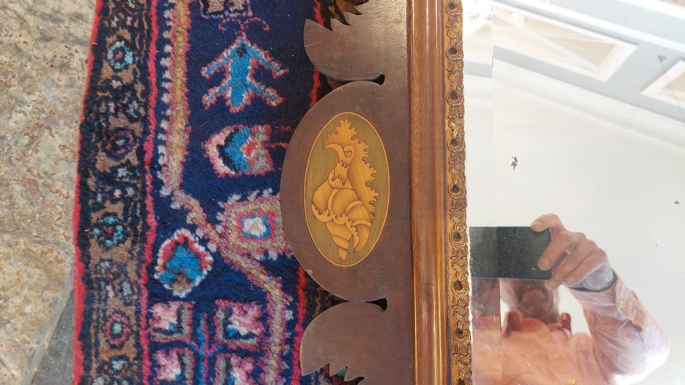 A late 19th-century George II style wall mirror framed in walnut with scrollwork edges, an oval marquetry motif at the bottom, and a giltwood eagle cresting at the top. View VI