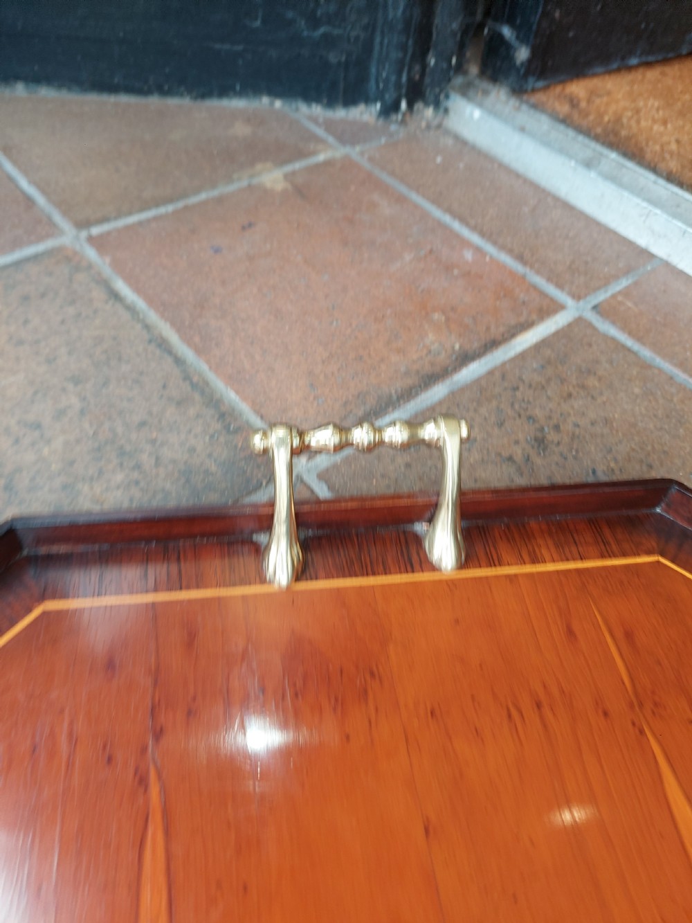 An octagonal wooden tray crafted from burr yew timber with rosewood crossbanding, featuring an oval central shell marquetry inlay and twin brass side handles. View III