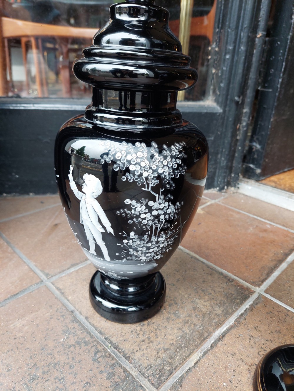 A set of three 19th-century black glass vessels decorated with hand-painted white enamel figures and landscapes. View VII