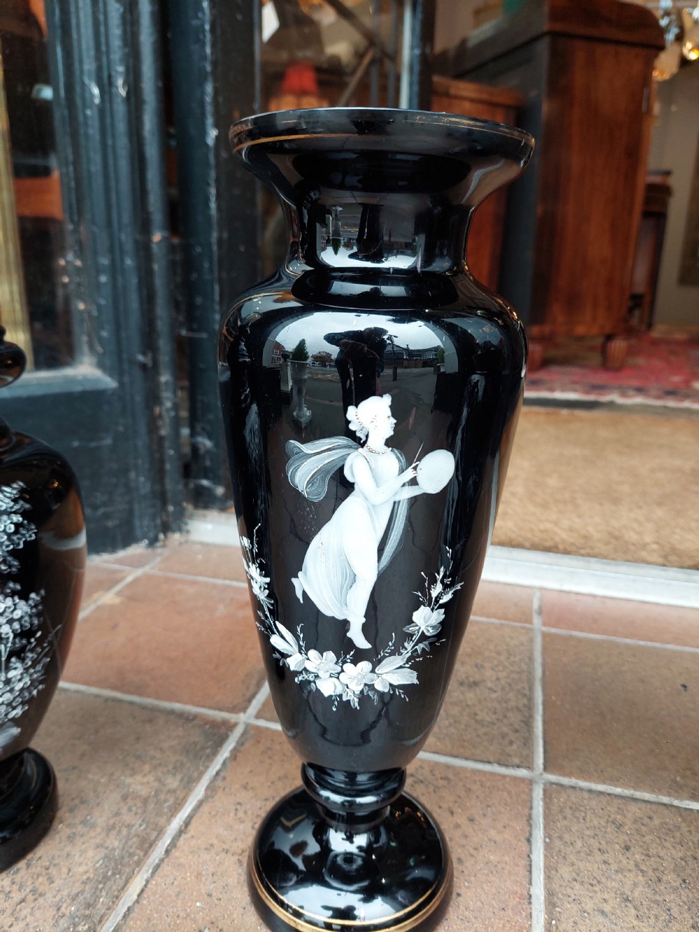 A set of three 19th-century black glass vessels decorated with hand-painted white enamel figures and landscapes. View VIII