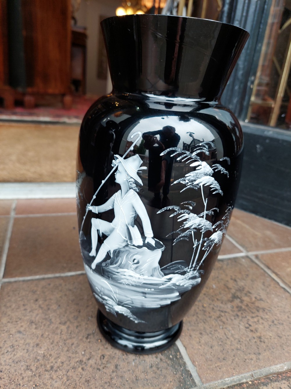 A set of three 19th-century black glass vessels decorated with hand-painted white enamel figures and landscapes. View IX