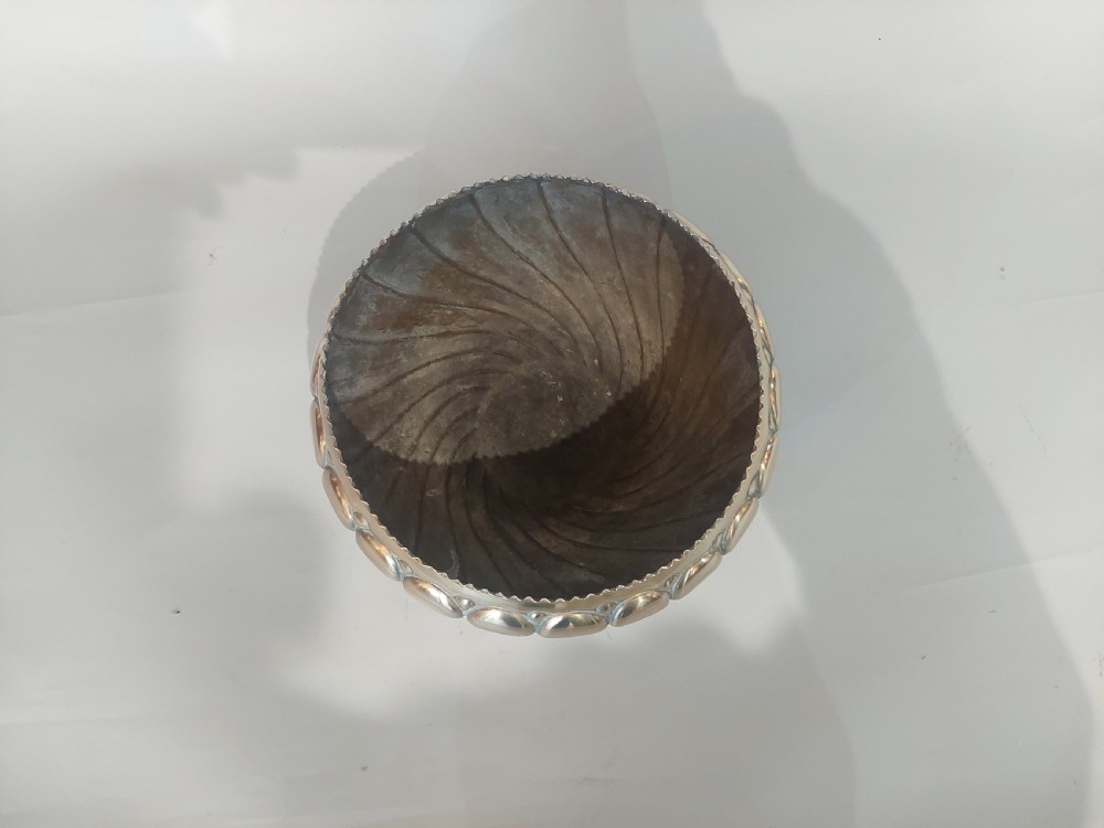 A polished brass Art Nouveau planter with swirling repousse lobed detailing and a beaded rim. View III