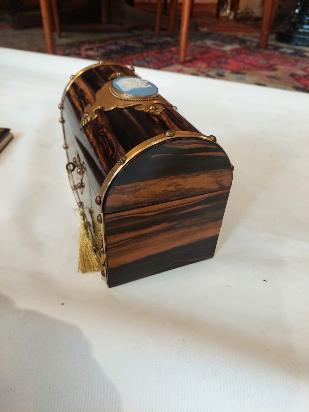 A Victorian coromandel wood desk set featuring a domed letter box and matching blotter book with ornate brass mounts and blue cameos. View VII