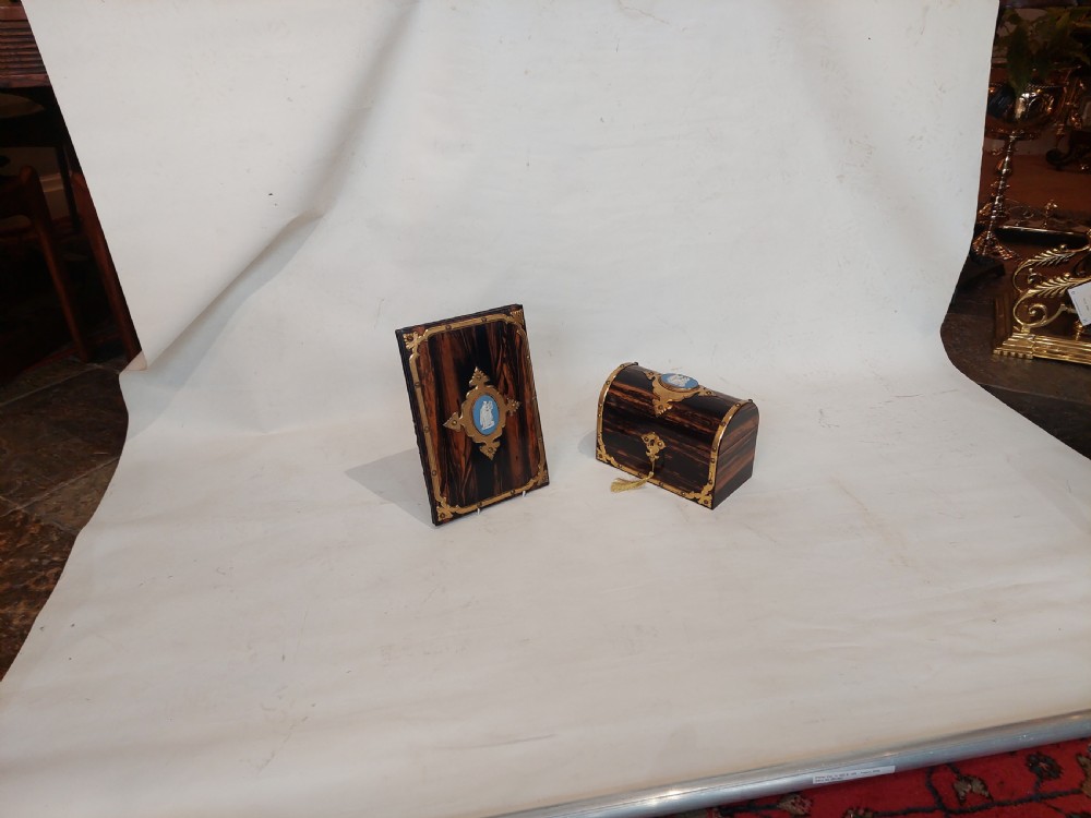 A Victorian coromandel wood desk set featuring a domed letter box and matching blotter book with ornate brass mounts and blue cameos. View XI