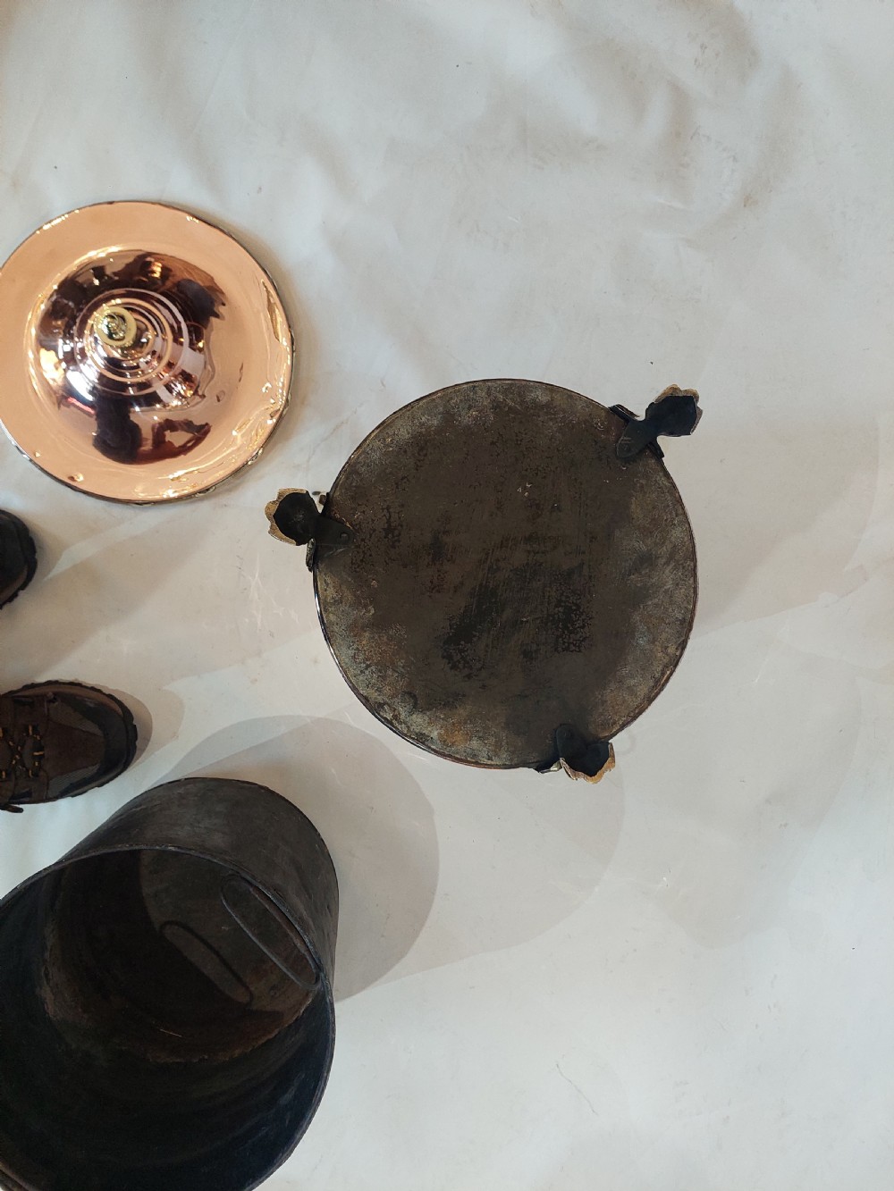 A cylindrical polished copper coal bucket featuring a fitted lid with a brass finial, side ring handles attached to lion mask mounts, and four detailed brass paw feet. View VIII