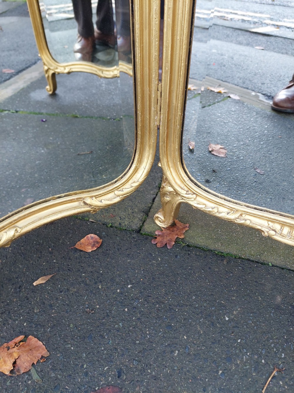 A three-panel folding triptych dressing table mirror featuring a gilded frame with Rococo carved cresting and bevelled glass. View VI