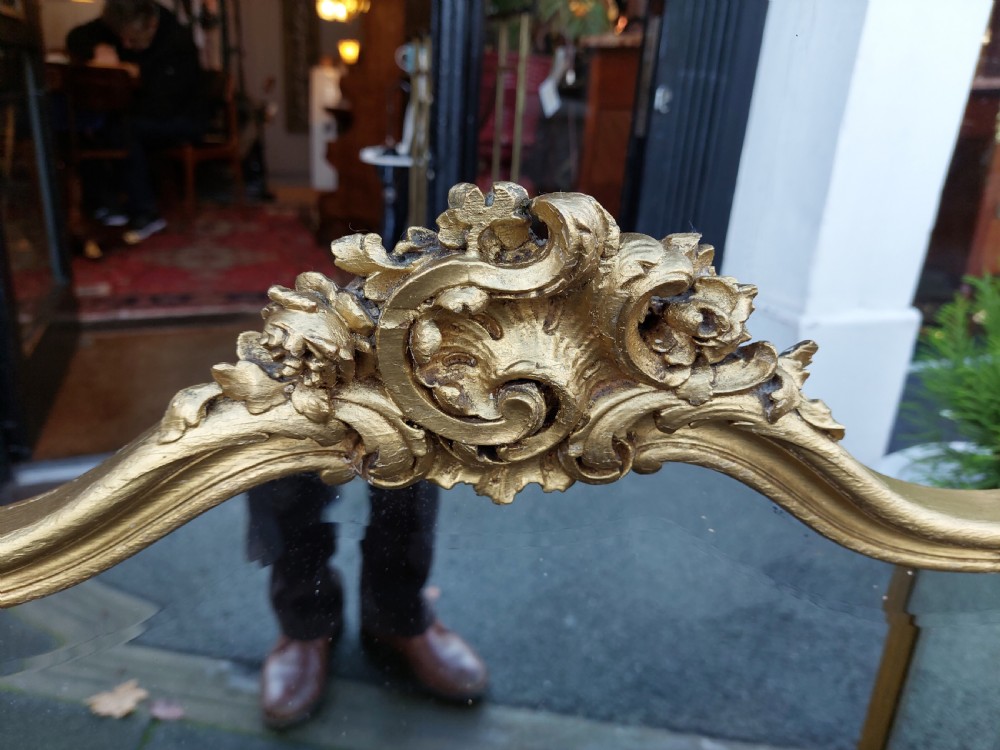 A three-panel folding triptych dressing table mirror featuring a gilded frame with Rococo carved cresting and bevelled glass. View VIII