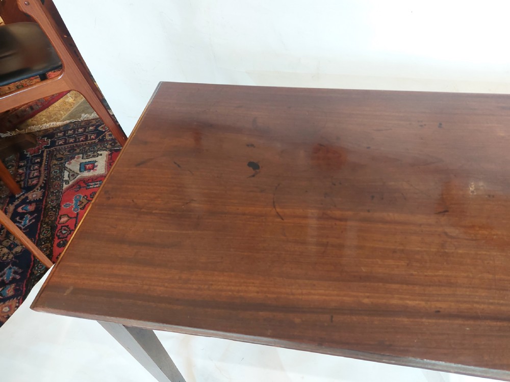 A mid-18th-century Georgian mahogany hall table featuring two drawer fronts with brass swan-neck handles and square tapered legs. View IX