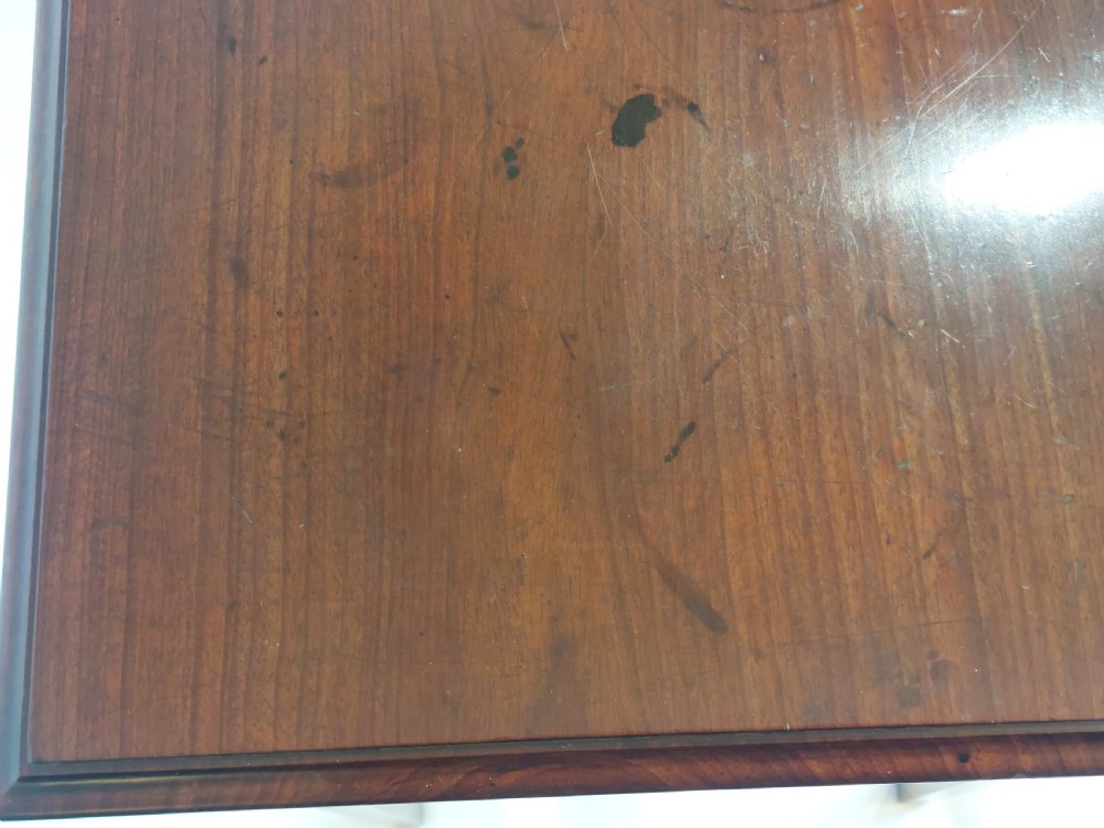A mid-18th-century Georgian mahogany hall table featuring two drawer fronts with brass swan-neck handles and square tapered legs. View X