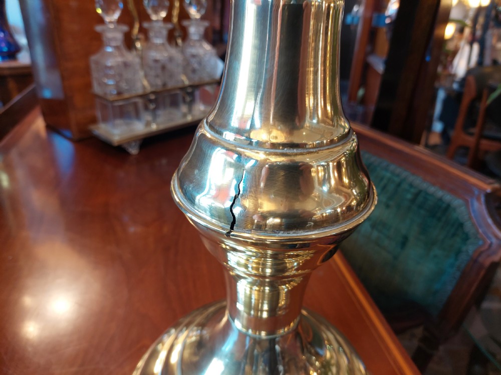 A polished late nineteenth-century pressed brass urn planter positioned on a turned pedestal base. View VII
