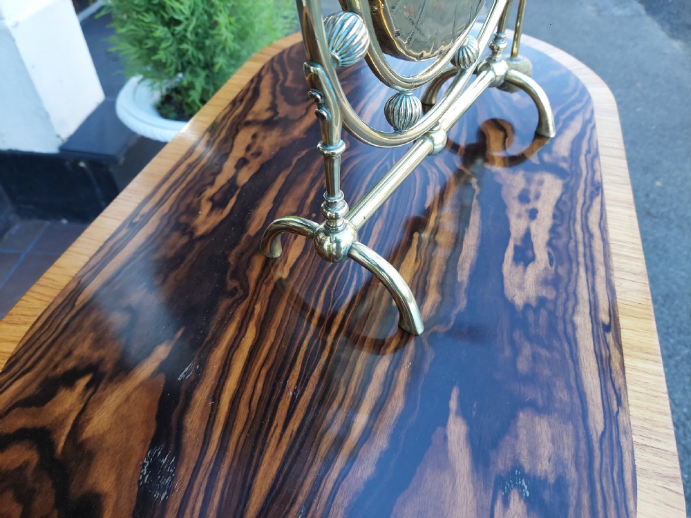 A late 19th-century polished metal tabletop gong with a circular hammered centre plate, ribbed decorative beads, a framed stand, and an attached hanging striker. View IV