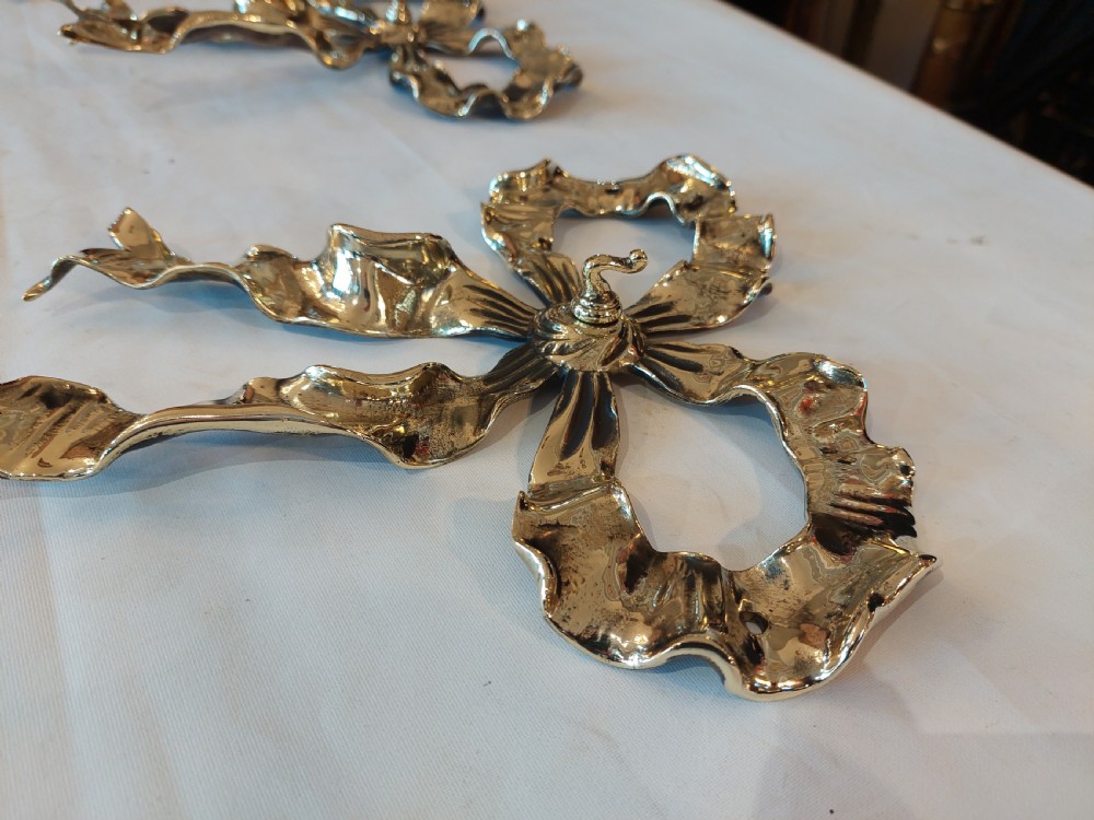 Set of 3 Ribbon Backed Early 20thC Brass Wall Hooks View III