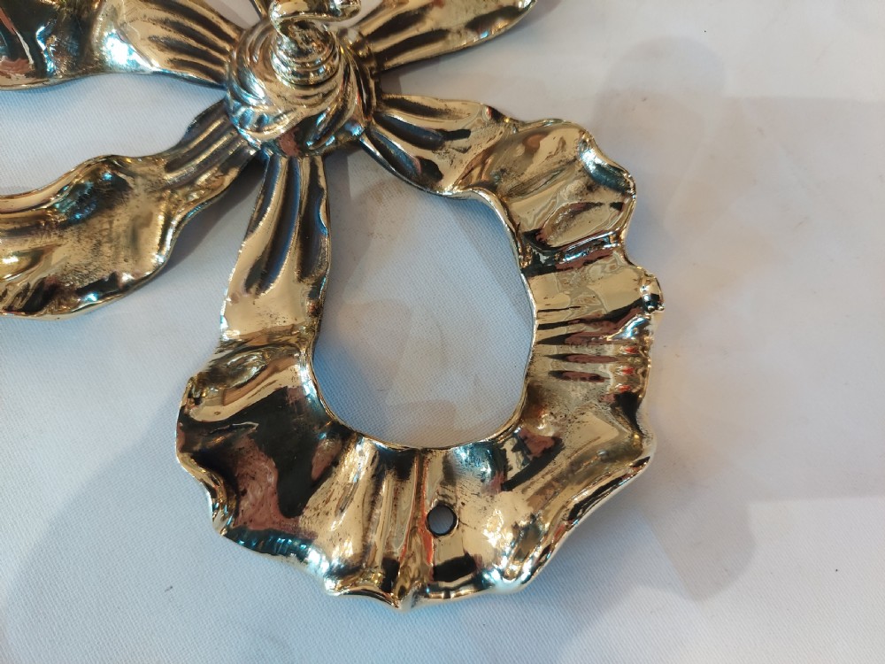 Set of 3 Ribbon Backed Early 20thC Brass Wall Hooks View VI