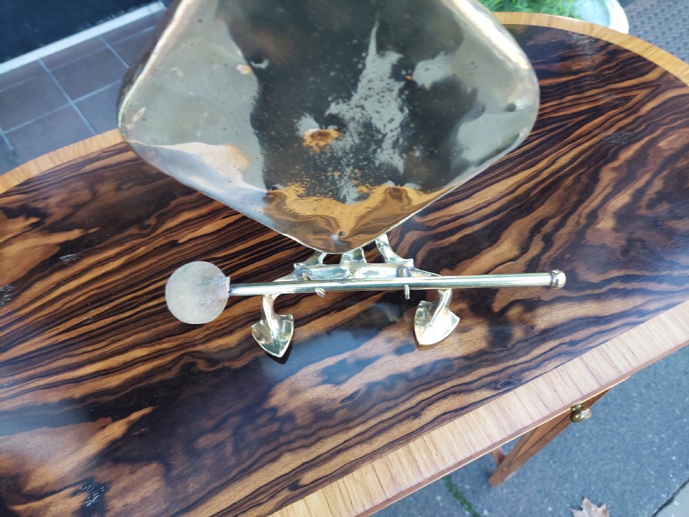An Art Nouveau silver-plated table gong featuring a diamond-shaped suspended plate, stylized arched metal frame, and a mallet resting on a dual-pronged base. View III