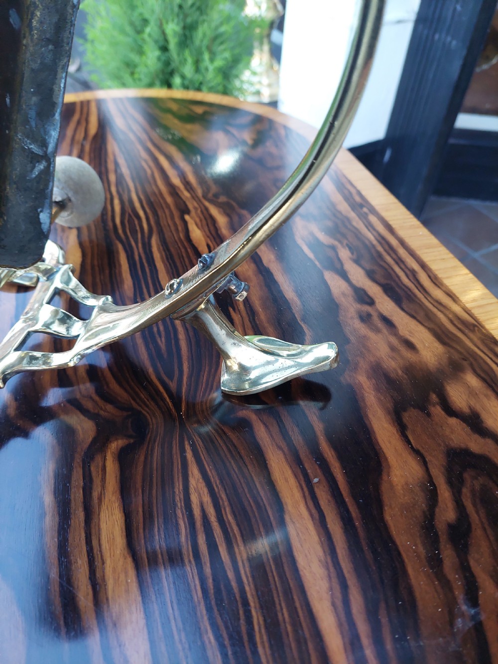 An Art Nouveau silver-plated table gong featuring a diamond-shaped suspended plate, stylized arched metal frame, and a mallet resting on a dual-pronged base. View V