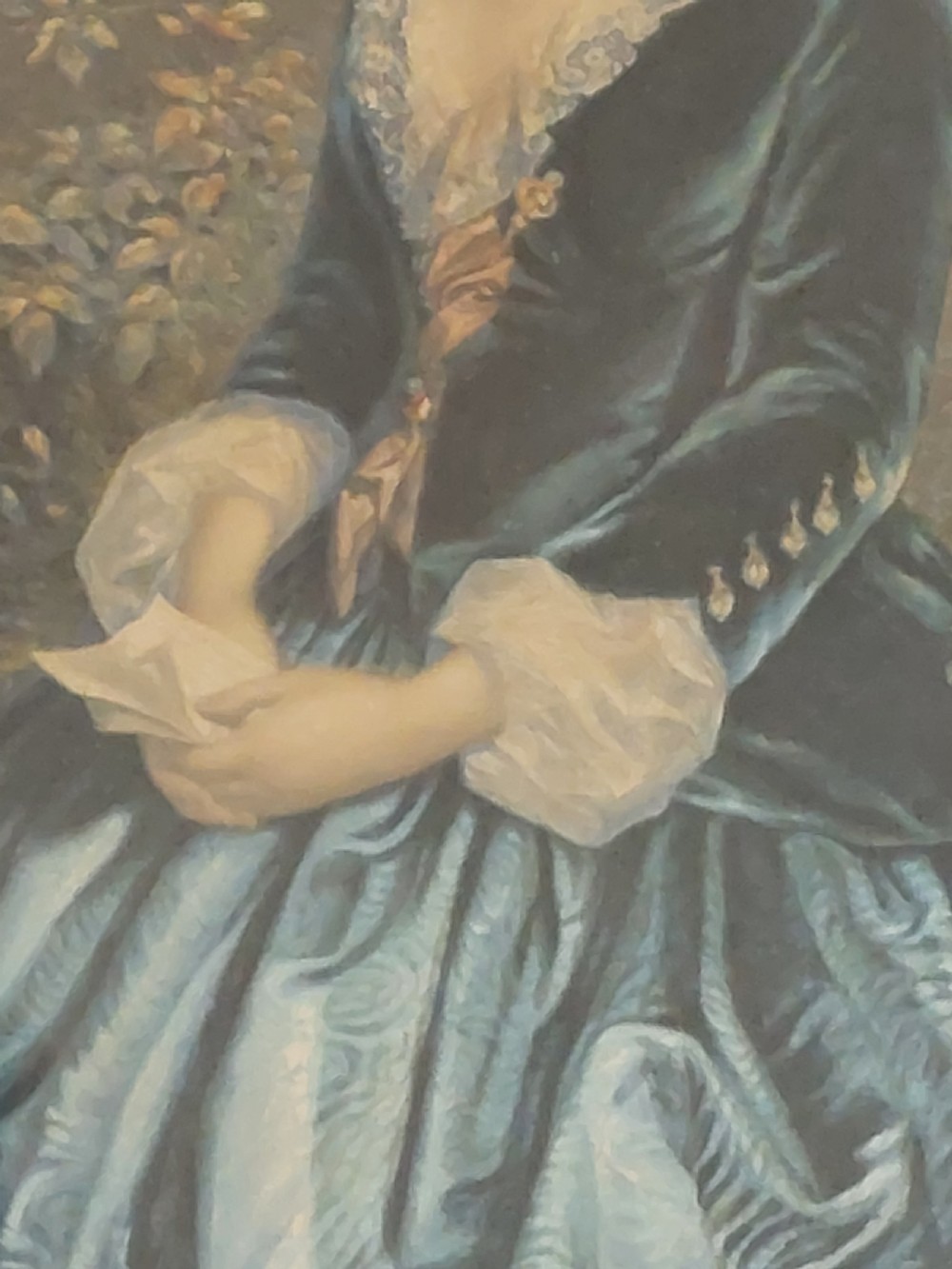 A framed 19th-century colour print depicting a seated woman in a dark green dress holding a letter, set within a wide timber veneer frame with a gilt inner slip. View III