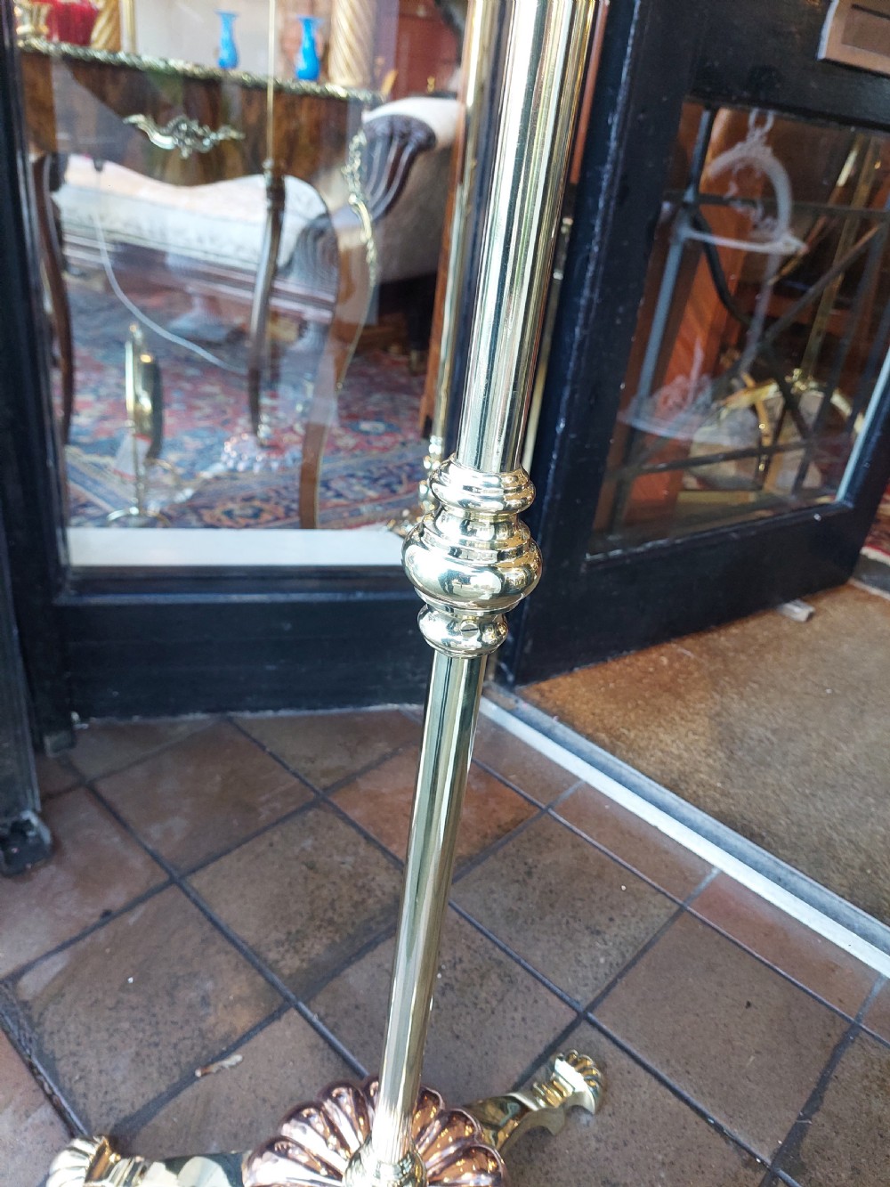 A late 19th-century brass and copper floor-standing oil lamp featuring claw feet and a cranberry glass font and shade. View IV