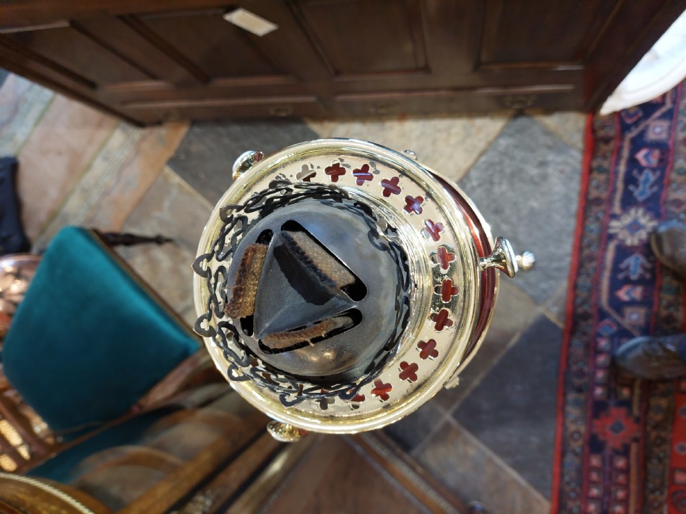 A late 19th-century brass and copper floor-standing oil lamp featuring claw feet and a cranberry glass font and shade. View IX