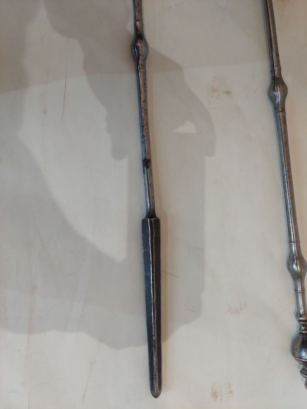 A pair of Georgian steel fire tools consisting of a poker and a shovel with a pierced decorative blade. View V