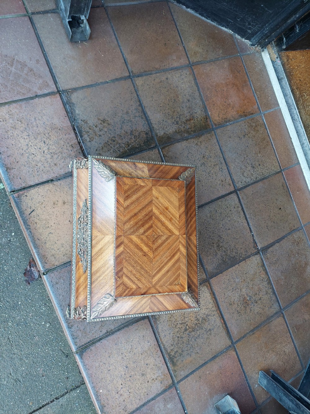 A Victorian kingwood jewellery box featuring a parquetry veneer pattern, serpentine sides, and silver-coloured ornamental corner mounts. View II