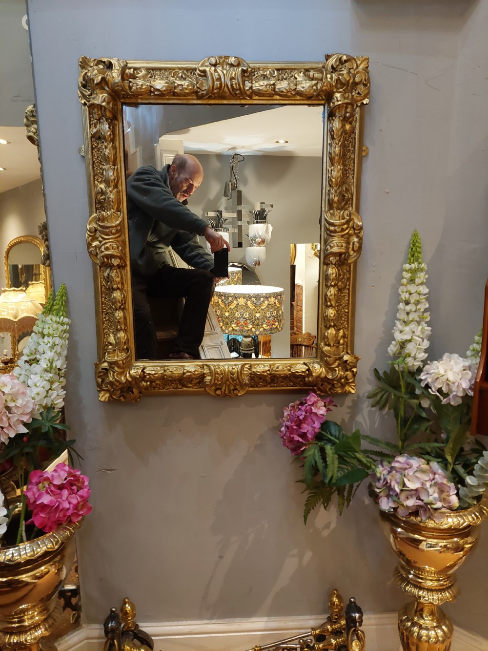 A rectangular 19th-century giltwood wall mirror featuring an ornate carved frame with sand-moulded gesso texture and scrolling foliage details. View II