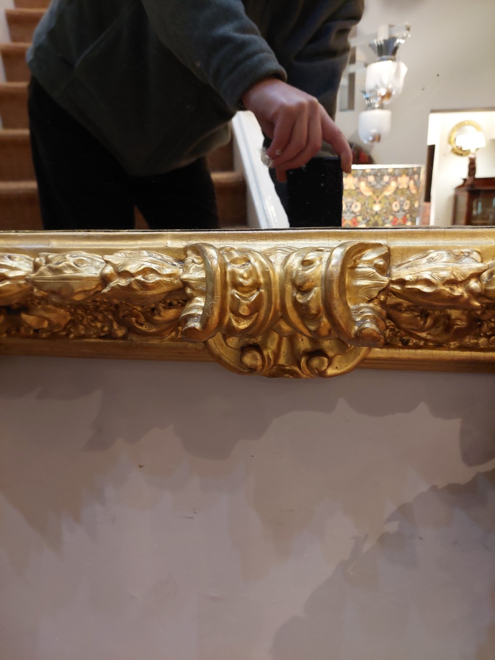 A rectangular 19th-century giltwood wall mirror featuring an ornate carved frame with sand-moulded gesso texture and scrolling foliage details. View VIII