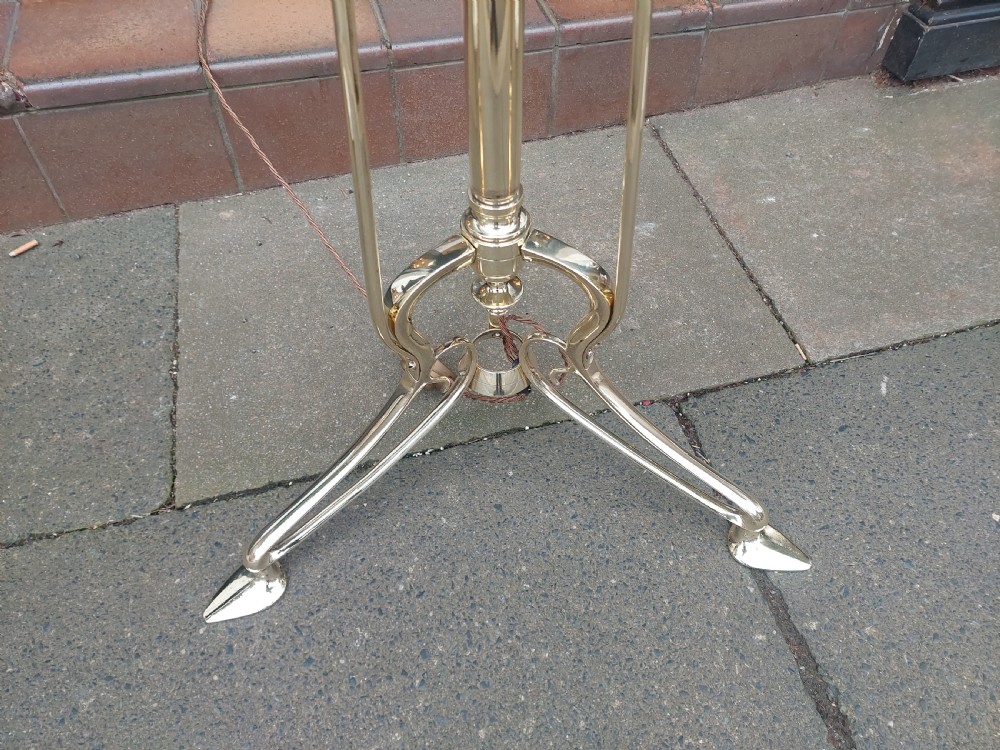 An Art Nouveau brass standard floor lamp featuring curved organic metalwork on a tripod base topped with a patterned floral fabric drum shade. View II