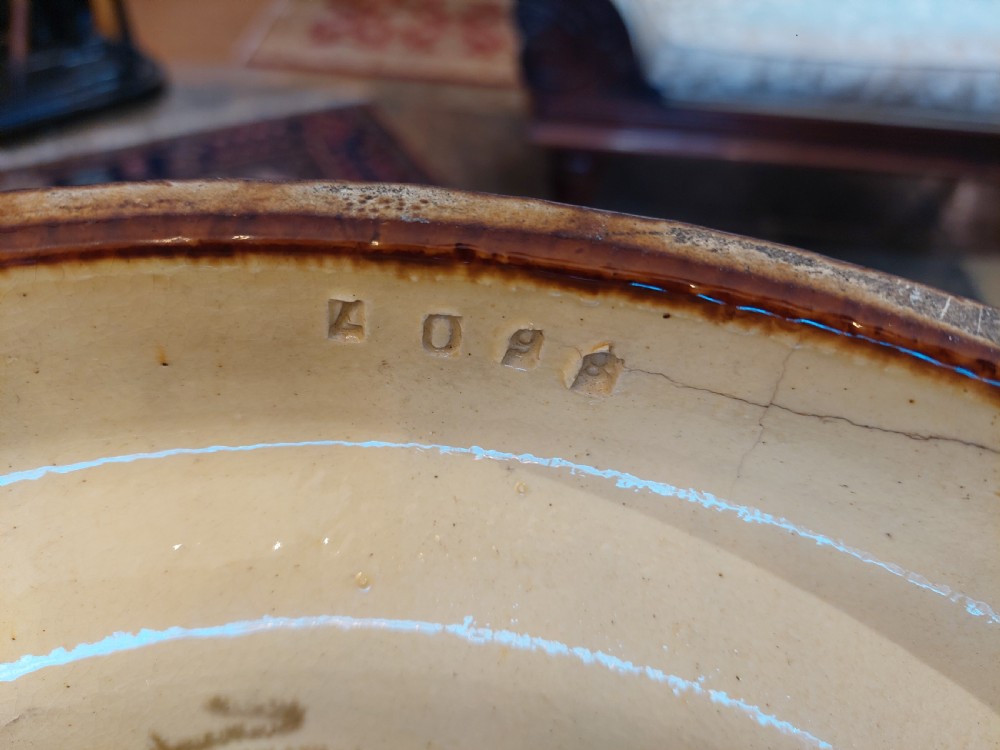 A Victorian Burmantofts majolica ceramic jardiniere and matching pedestal stand featuring painted floral panels and cream relief scrollwork on an ochre glaze. View VI